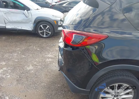 2013 Mazda Cx-5 Touring z USA, uszkodzony, nr VIN JM3KE2CE9D0148142